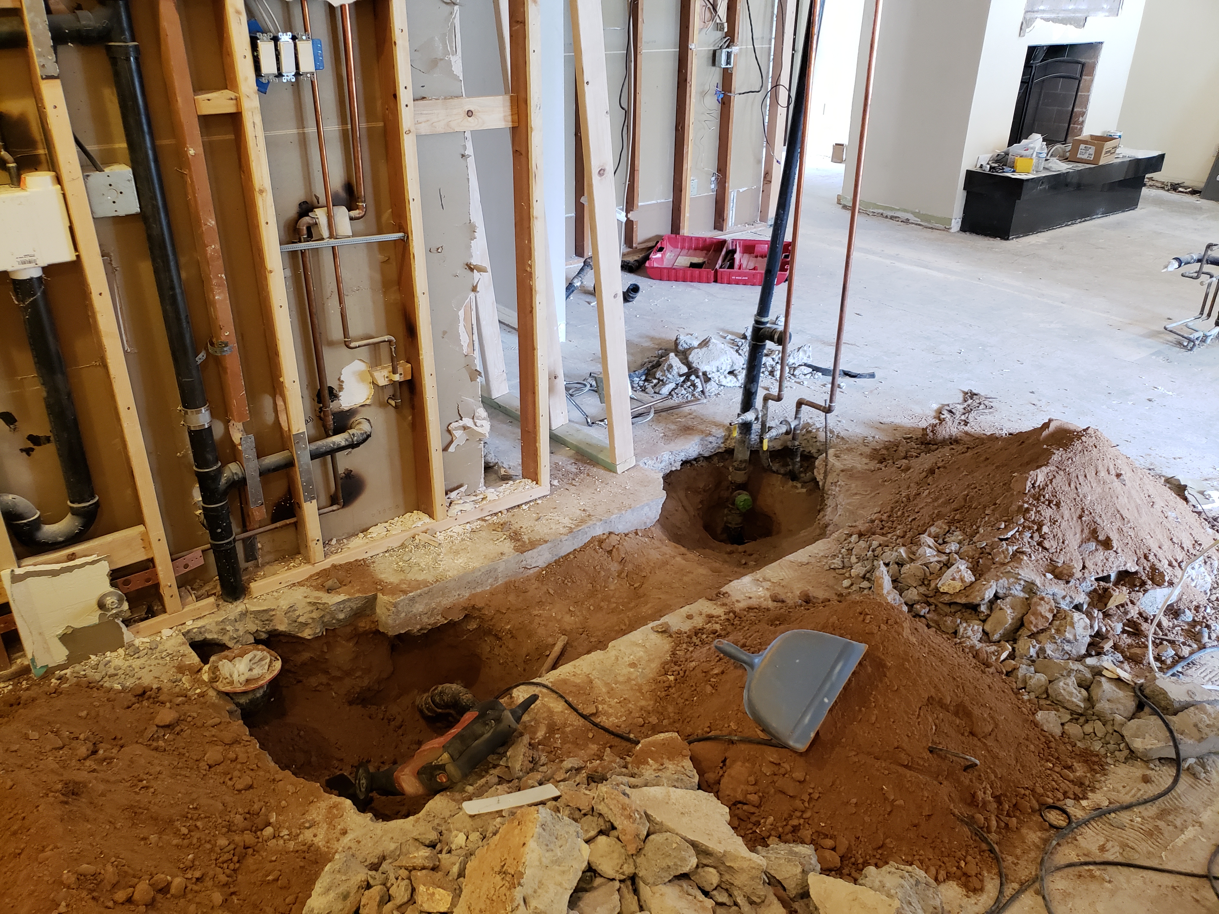 Handyman installing lighting, faucets, and hardware